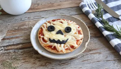 Halloween Mini Pizzas: Spooky Snack Board Idea - ready to serve